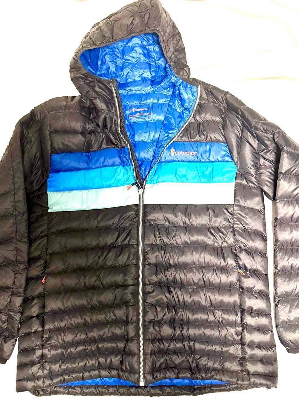 cotopaxi Men's Black Hooded Puffer Jacket with Blue and Teal Stripes